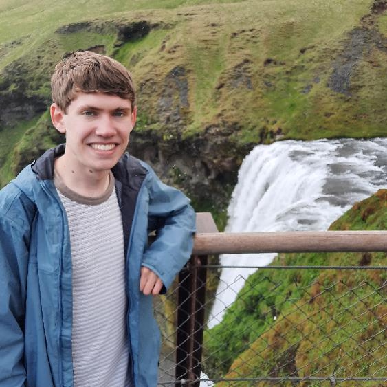 David Haroldsen in front of a beautiful Icelandic waterfall.